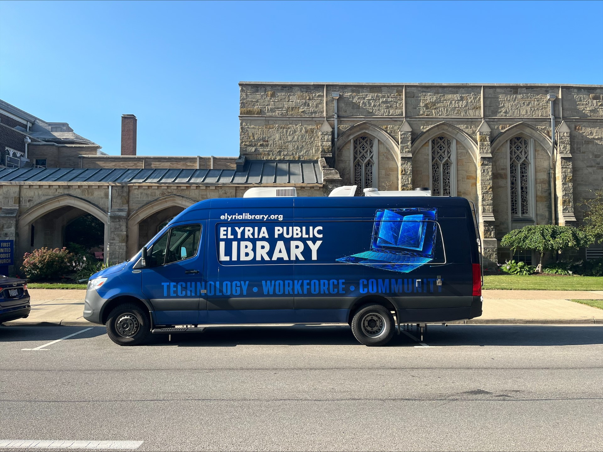 EPL Workforce & Outreach Center mobile van parked in downtown Elyria.